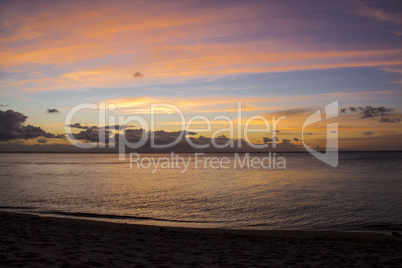 Colorful tropical sunset over a calm ocean