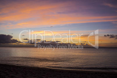 Colorful tropical sunset over a calm ocean