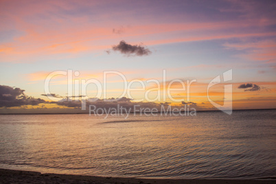 Colorful tropical sunset over a calm ocean