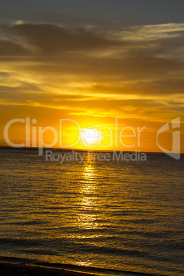 Colorful tropical sunset over a calm ocean