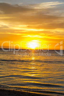 Colorful tropical sunset over a calm ocean