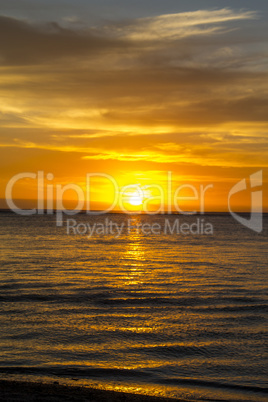 Colorful tropical sunset over a calm ocean