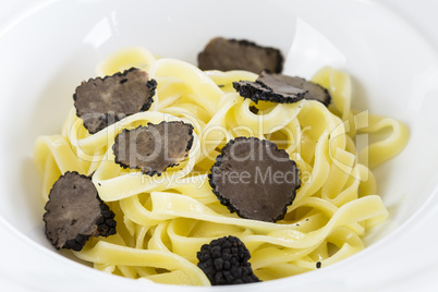 Serving of pasta with black Perigord truffles
