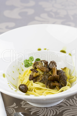 Italian pasta served with fried chanterelles