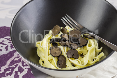 Sliced black Perigord truffles with noodles