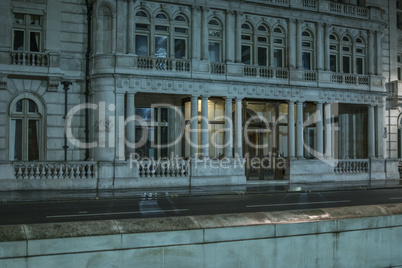 Facade of classical architecture building at night