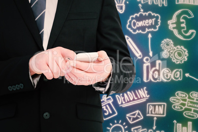 Composite image of businessman sending a text message