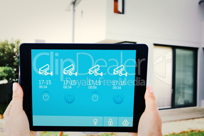 Composite image of businesswoman holding digital tablet