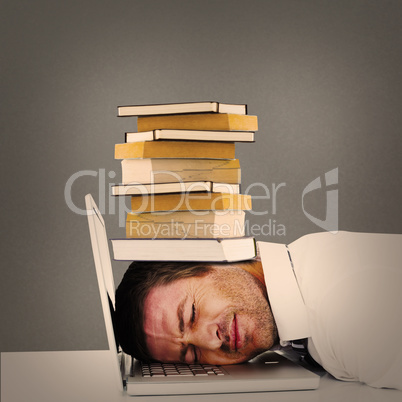 Composite image of tired businessman resting on laptop