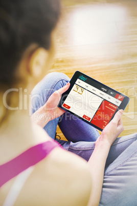 Composite image of woman using tablet at home