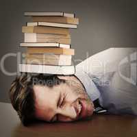 Composite image of casual businessman sleeping at his desk