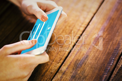 Composite image of woman using smartphone