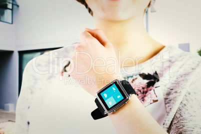 Composite image of woman using smartwatch