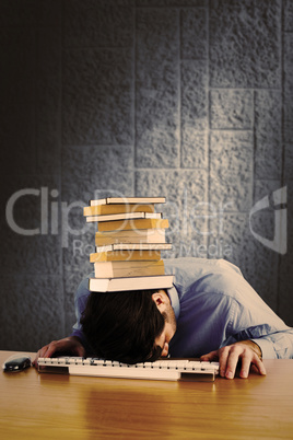 Composite image of businessman sleeping on his keyboard