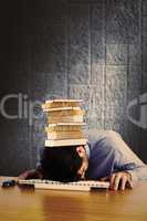 Composite image of businessman sleeping on his keyboard