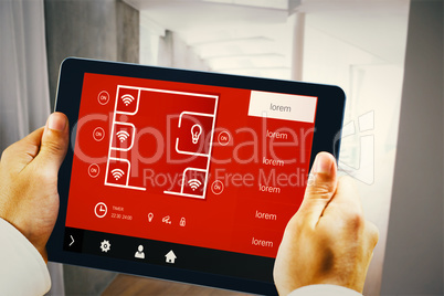 Composite image of man using tablet pc