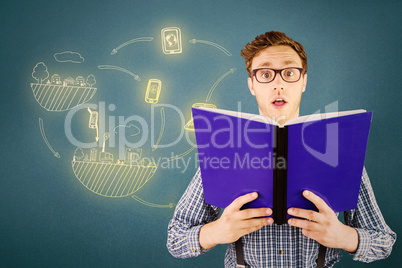 Composite image of geeky businessman holding a book