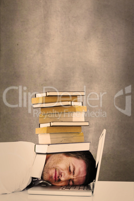 Composite image of tired businessman resting on laptop