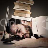 Composite image of businessman resting head on laptop keyboard