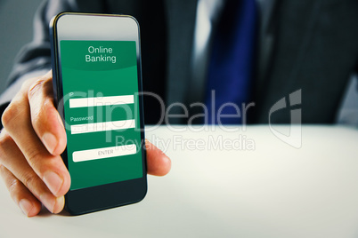 Composite image of businessman using smartphone