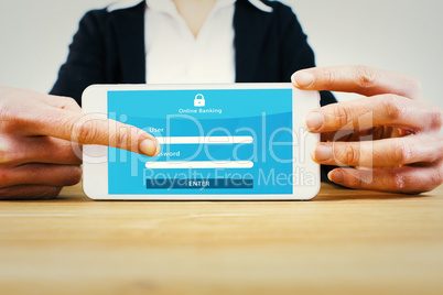Composite image of businesswoman using her tablet pc Composite image of businesswoman using her tablet pc
