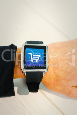 Composite image of businesswoman using a smart watch