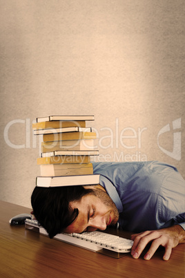 Composite image of businessman sleeping with his head on the key