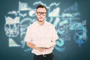 Composite image of geeky young man reading from black book