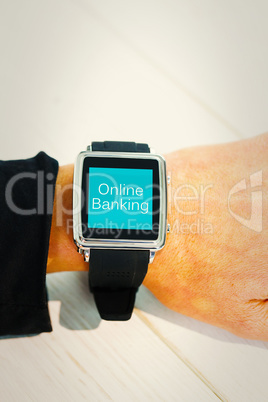 Composite image of businesswoman using a smart watch