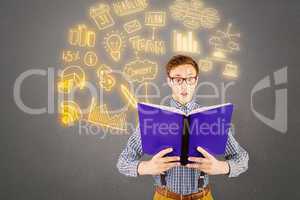 Composite image of geeky businessman reading a book