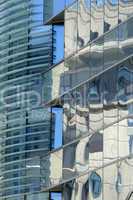 Reflection in windows of modern office building