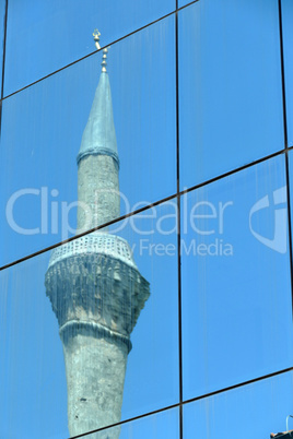 Reflection in windows of modern office building