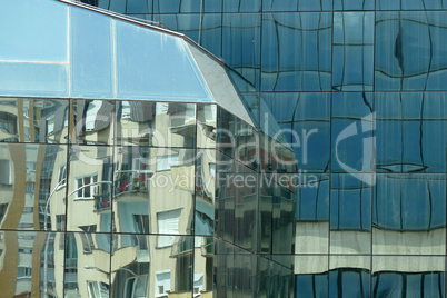 Reflection in windows of modern office building