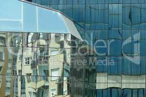 Reflection in windows of modern office building