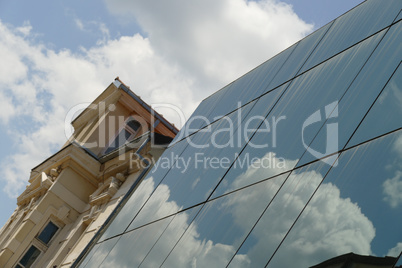 Reflection in windows of modern office building