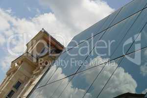 Reflection in windows of modern office building