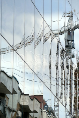 Reflection in windows of modern office building