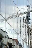 Reflection in windows of modern office building