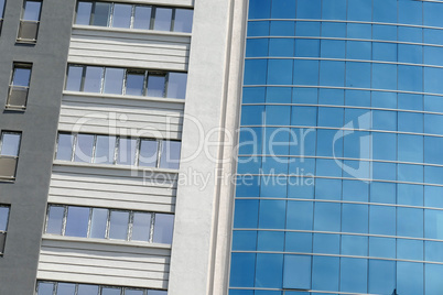 Reflection in windows of modern office building