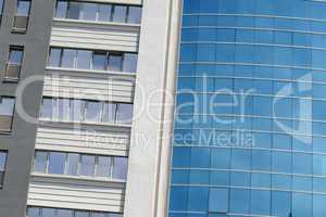 Reflection in windows of modern office building