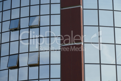 Reflection in windows of modern office building