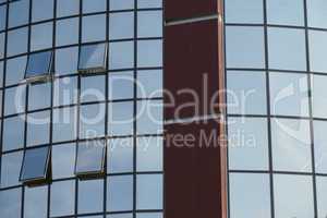 Reflection in windows of modern office building