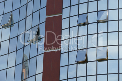 Reflection in windows of modern office building