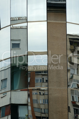 Reflection in windows of modern office building