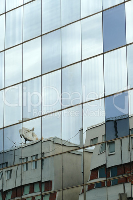 Reflection in windows of modern office building