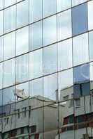 Reflection in windows of modern office building