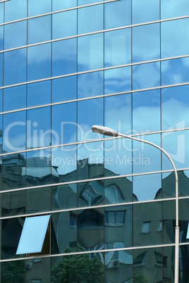 Reflection in windows of modern office building