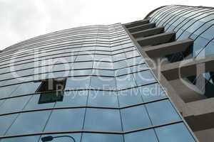 Reflection in windows of modern office building