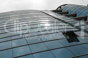 Reflection in windows of modern office building