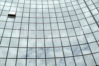 Reflection in windows of modern office building